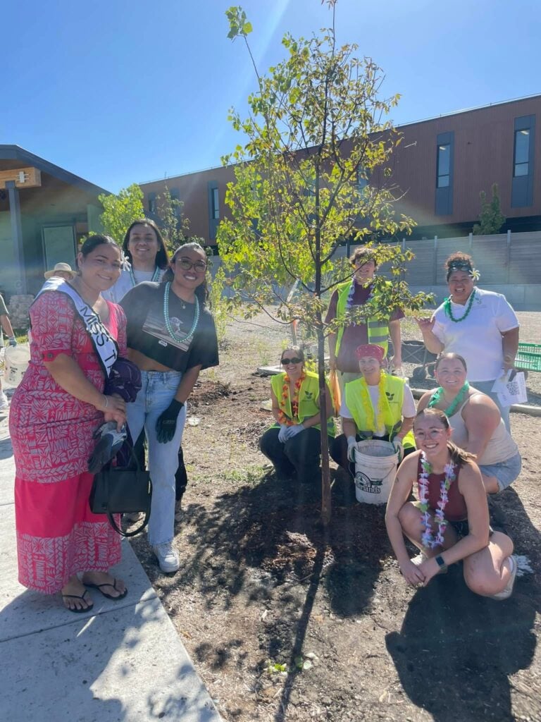 A group of people at a tree planting
